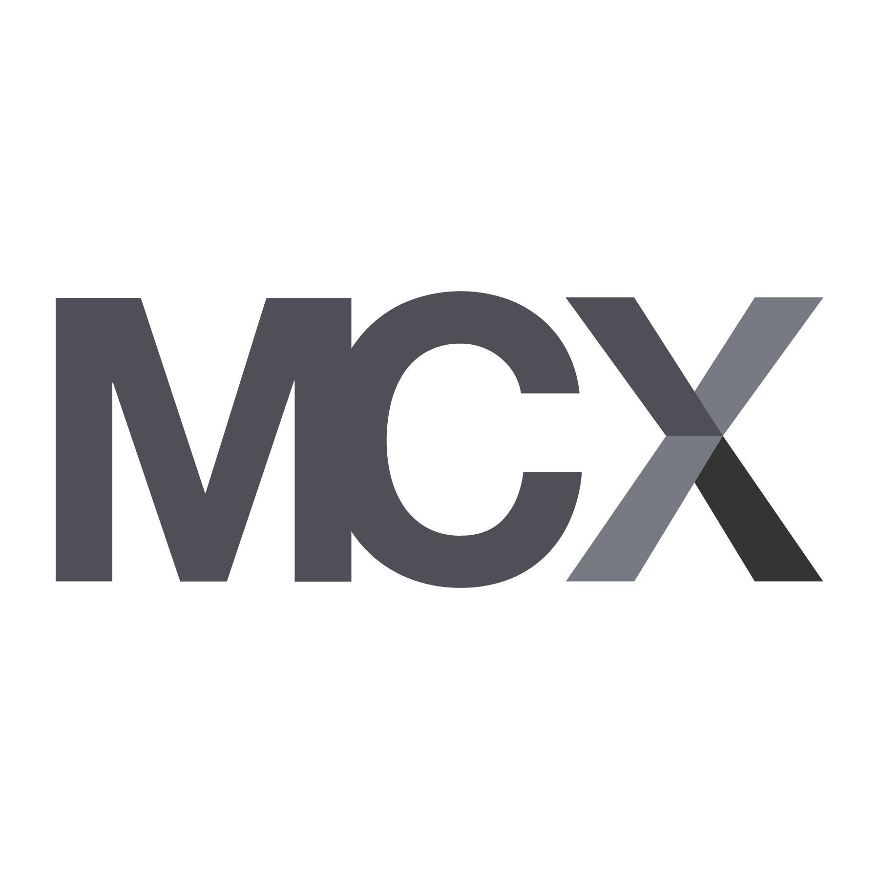 Un logotipo que presenta las letras M, C y X en un diseño estilizado.