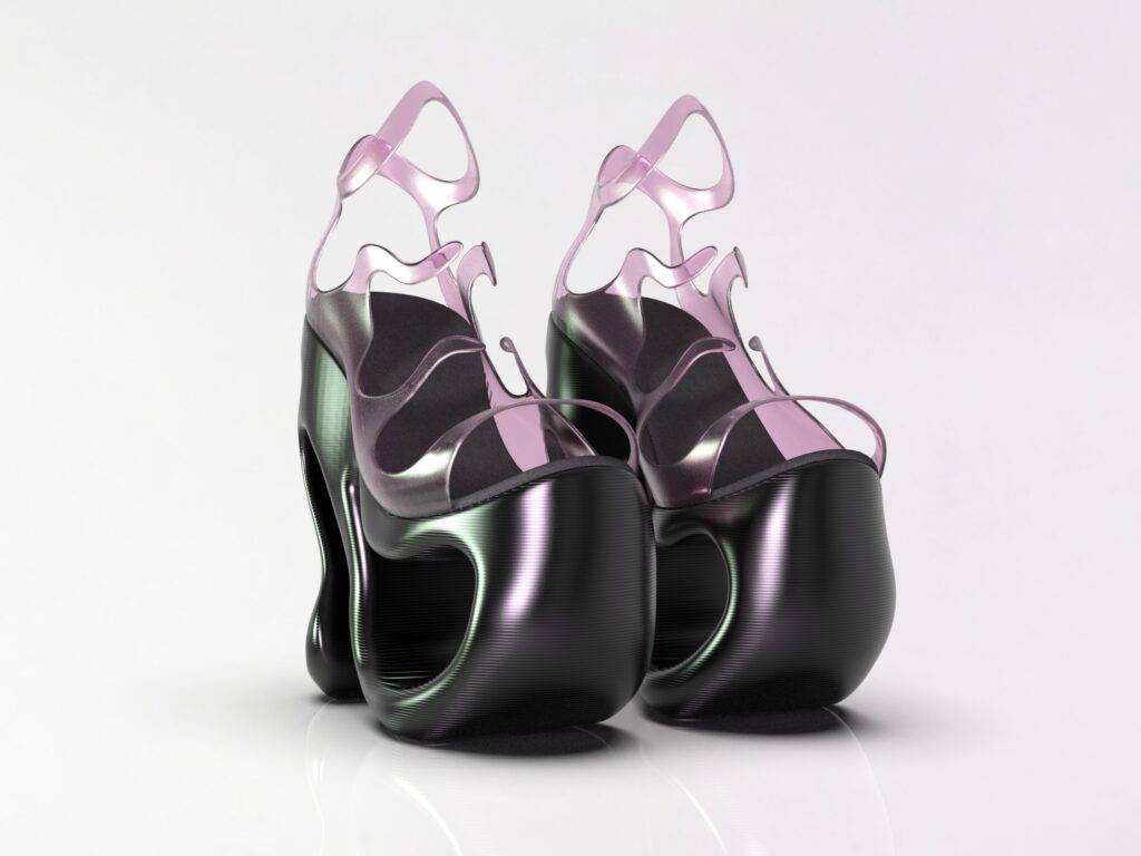 Un par de elegantes zapatos de tacón alto con un diseño moderno en tonos negro y rosa.