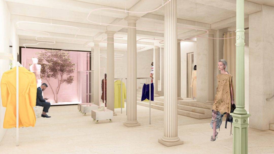 Una moderna tienda de moda con columnas, maniquíes y prendas coloridas expuestas.