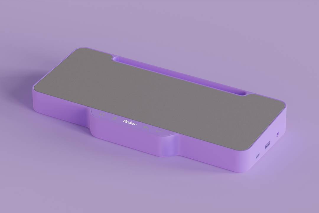 Un dispositivo de color púrpura con una superficie gris, diseñado para soporte o carga.