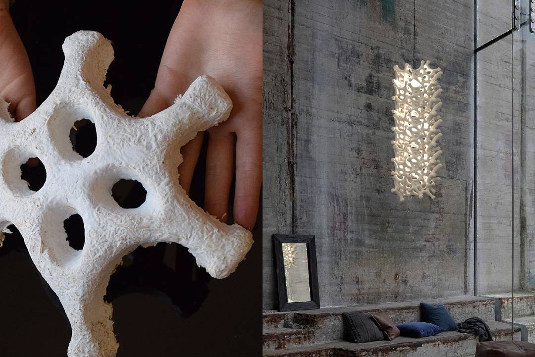 La imagen muestra un objeto escultórico en forma de estrella en las manos de una persona y una lámpara de diseño orgánico colgando de una pared de piedra expuesta.
