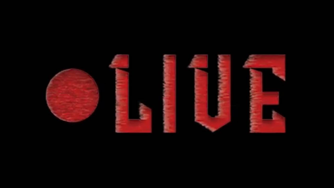 La imagen muestra el texto 'LIVE' en un estilo gráfico prominente sobre un fondo negro con un círculo rojo.