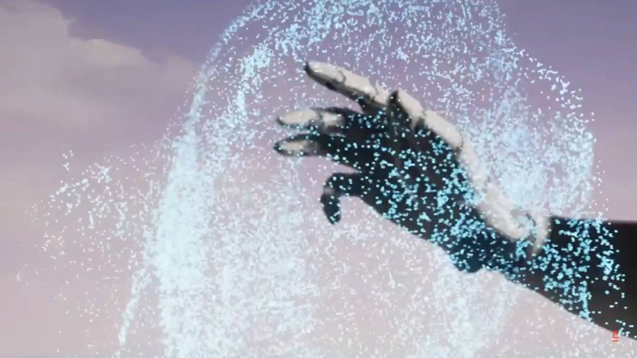 La imagen muestra una mano que interactúa con partículas brillantes de color azul en un entorno futurista.