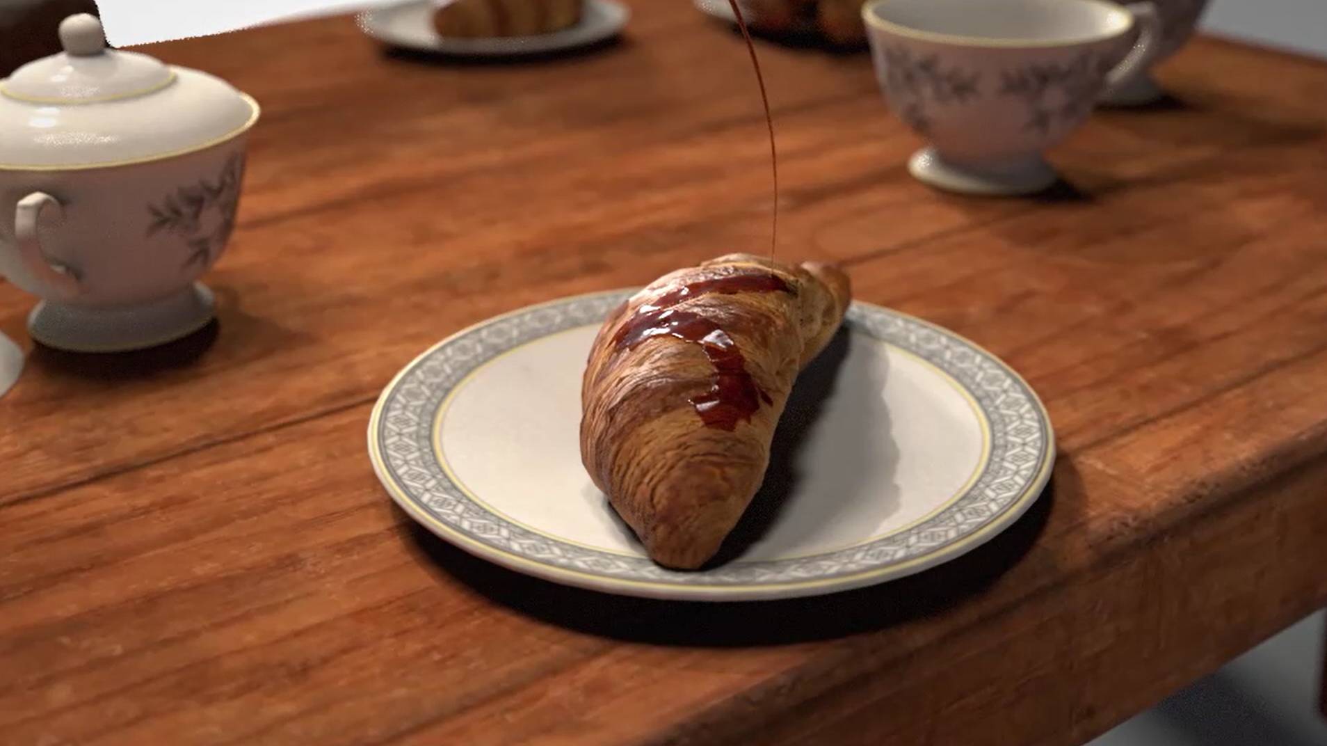 Un delicioso croissant con mermelada sobre un plato en una mesa de madera.