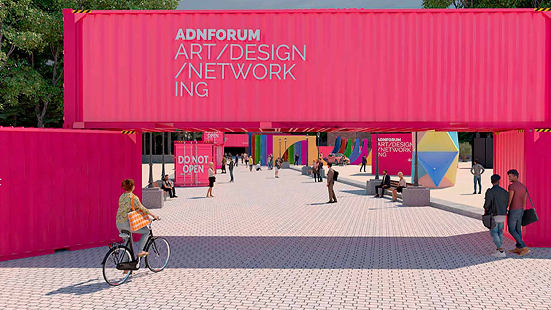 Una vista de un evento artístico en un espacio urbano con contenedores de colores vibrantes.