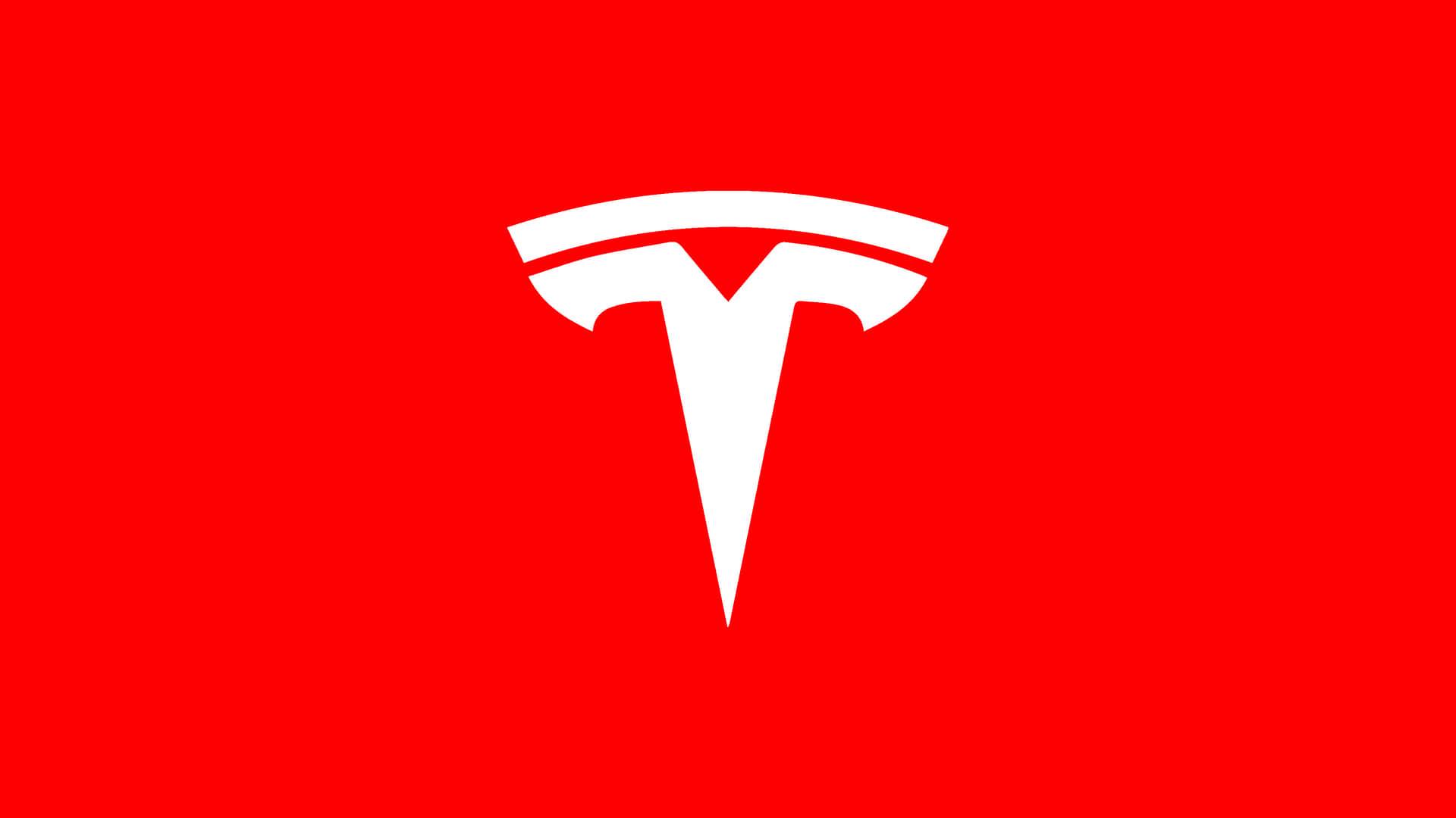 Logo de la marca Tesla sobre un fondo rojo.