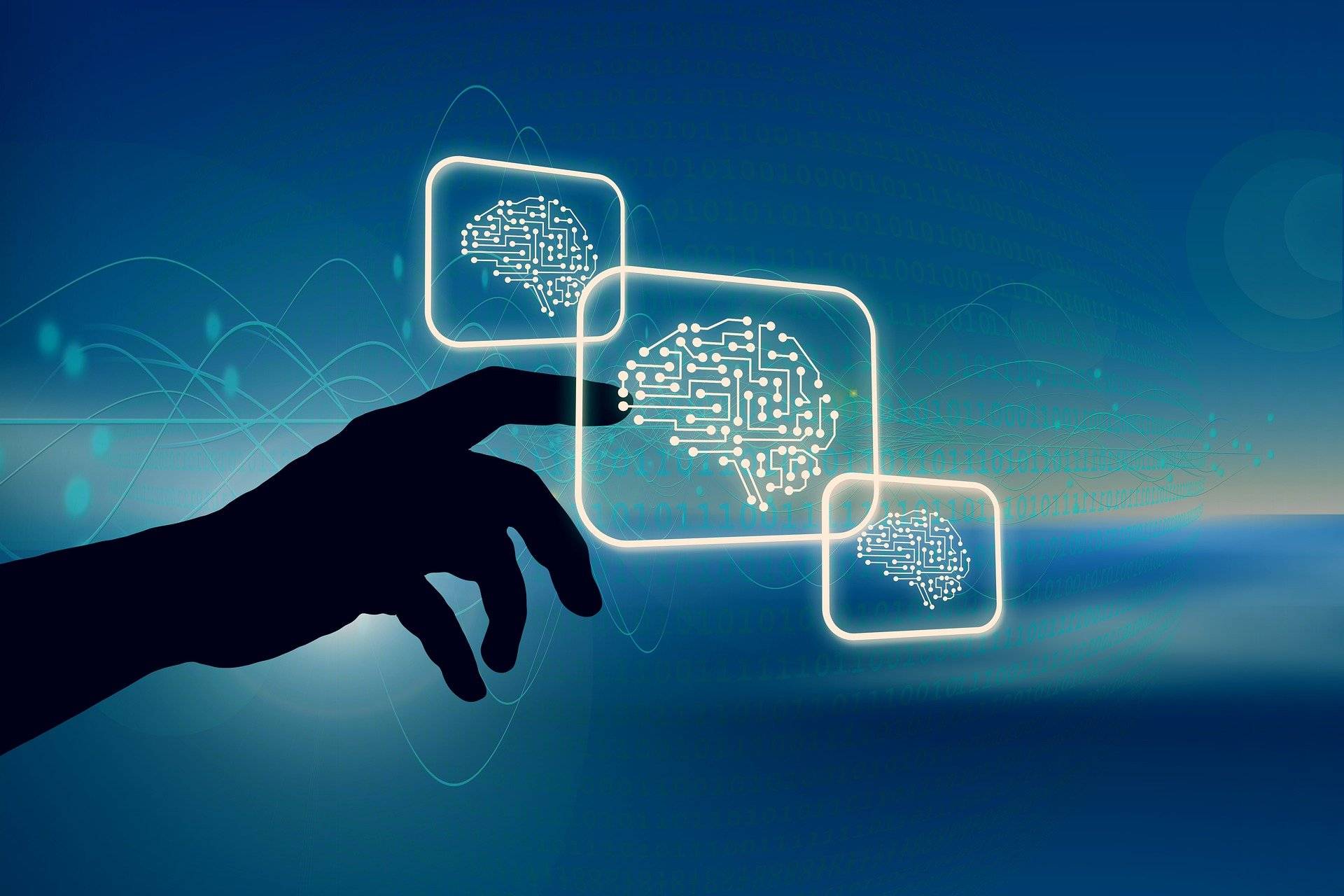 Una mano toca imágenes digitales de cerebros con circuitos, representando la inteligencia artificial.