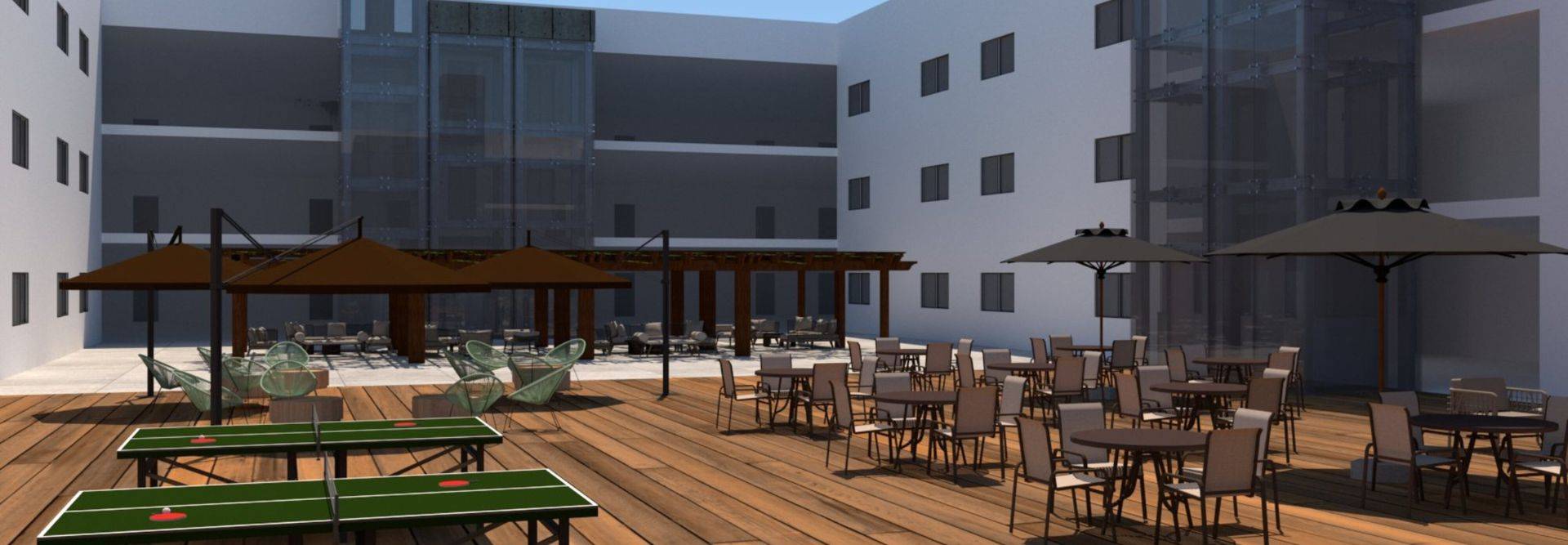 Espacio al aire libre con mesas y sillas, sombrillas y mesas de ping pong.