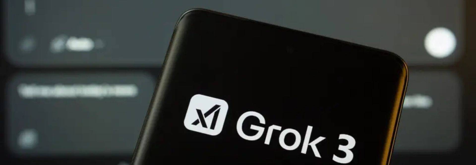 La imagen muestra un teléfono móvil con el logo de Grok 3 en primer plano.
