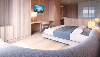 Una moderna habitación de hotel con paredes de madera y mobiliario minimalista.