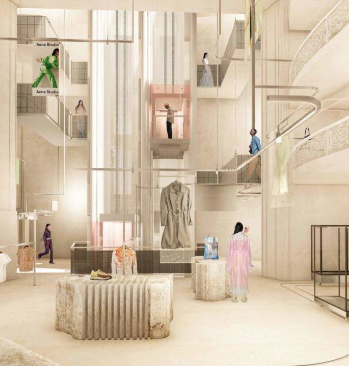Imagen de un moderno espacio comercial con múltiples niveles y exhibiciones de ropa.