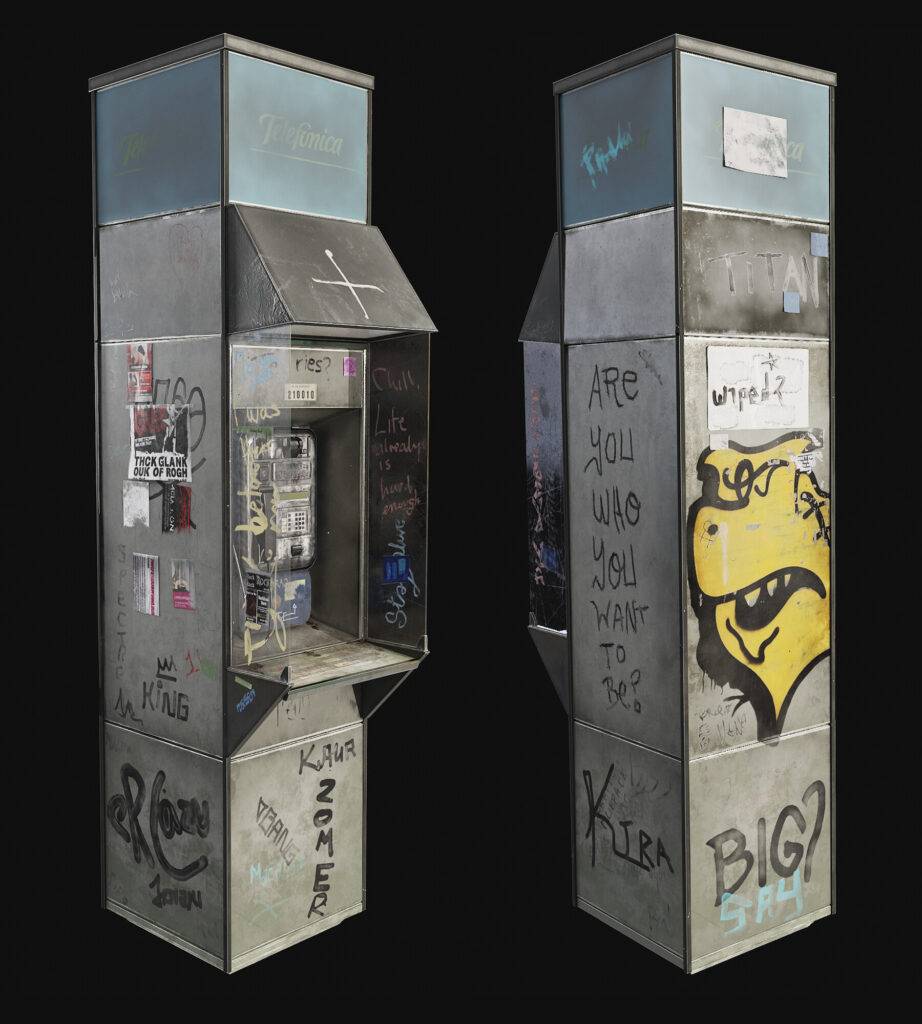 Un par de estructuras metálicas con grafitis y pegatinas en diferentes lados.